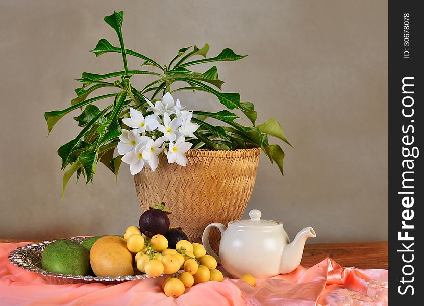 Tropical fruit and flower composition in Still life concept