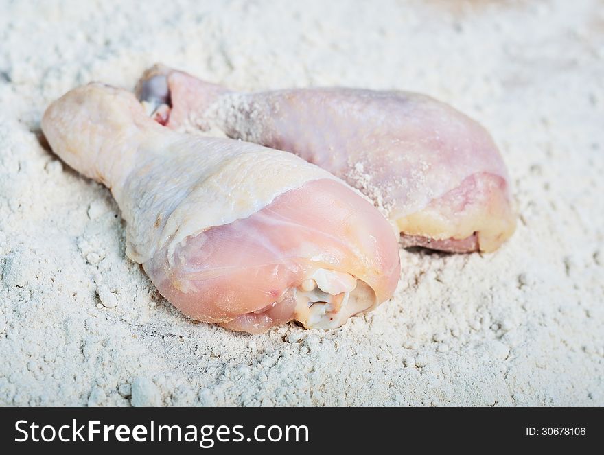 Close up Chicken raw meat over flour