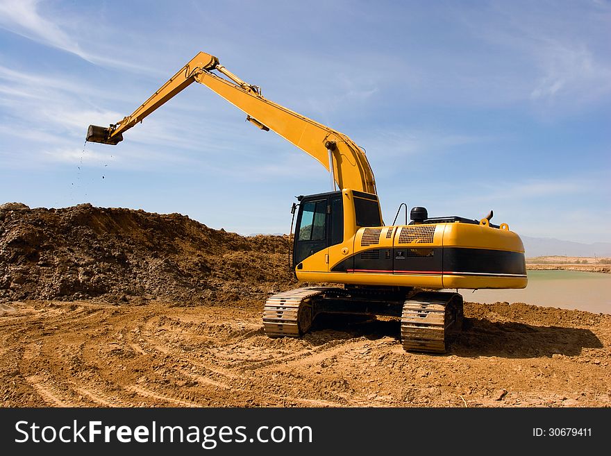 Orange excavator at construction site