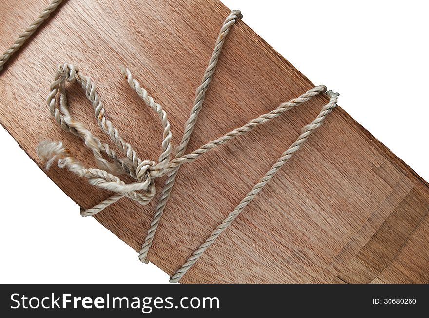 Veneer sheet tied up with rope isolated on white. Veneer sheet tied up with rope isolated on white
