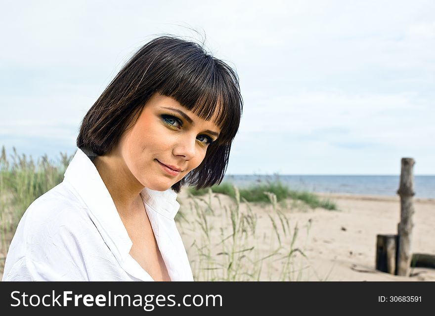 Portrait of young woman on a beach