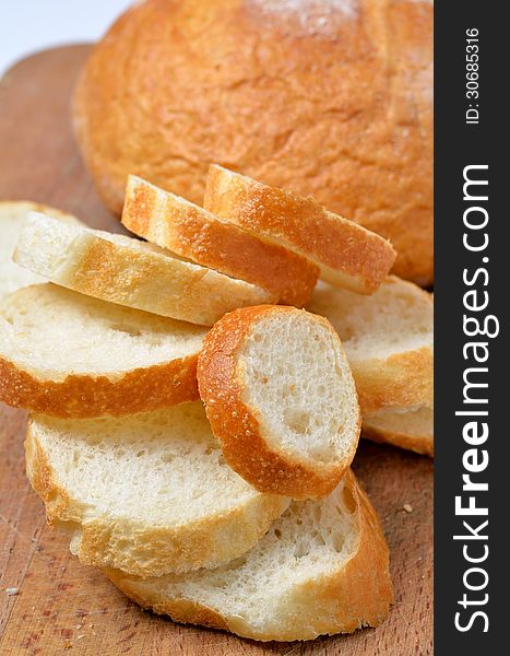 Fresh wheat sliced bread on kichen board