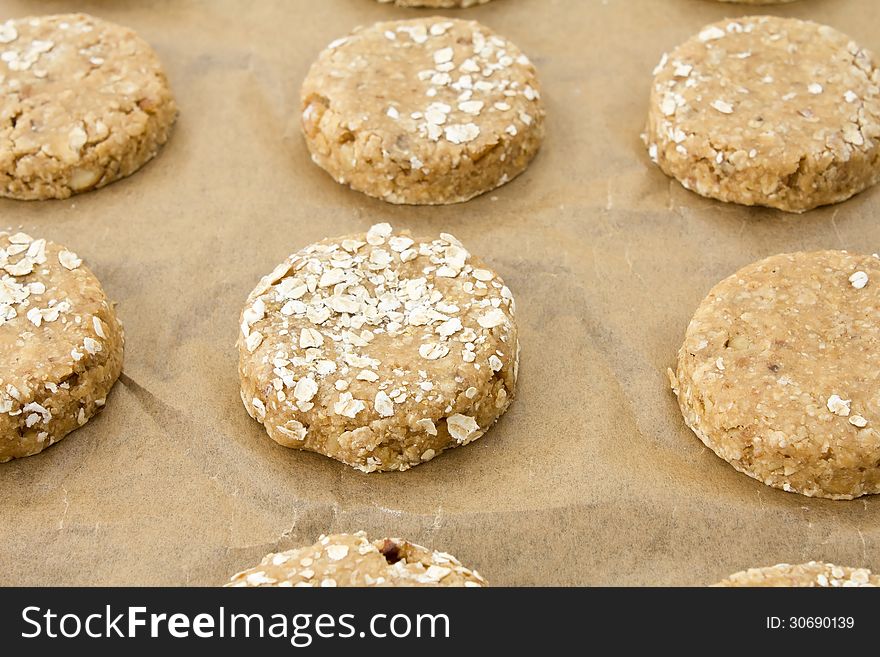 Raw oatmeal cookie dough on a baking sheet