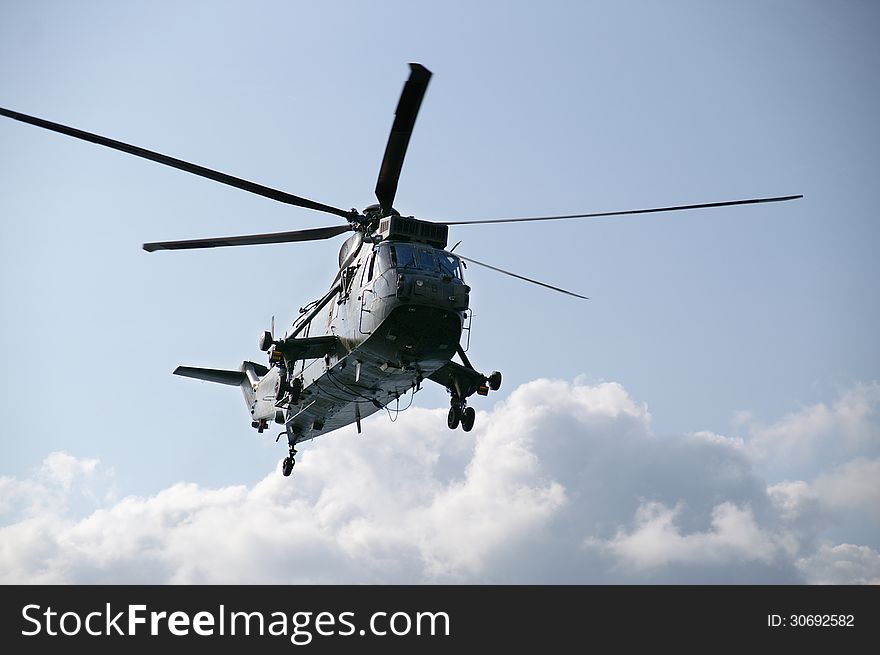 Low flying seaking helicopter on search and rescue. Low flying seaking helicopter on search and rescue