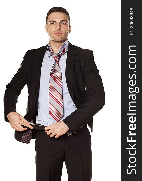 Attractive businessman fastened the belt on his pants
