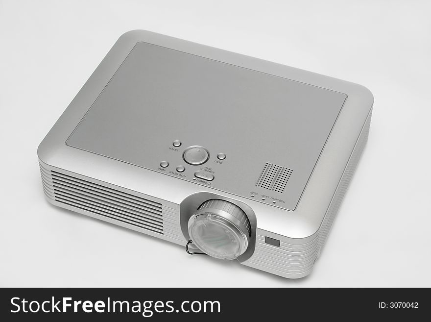 A digital projector isolated on white.