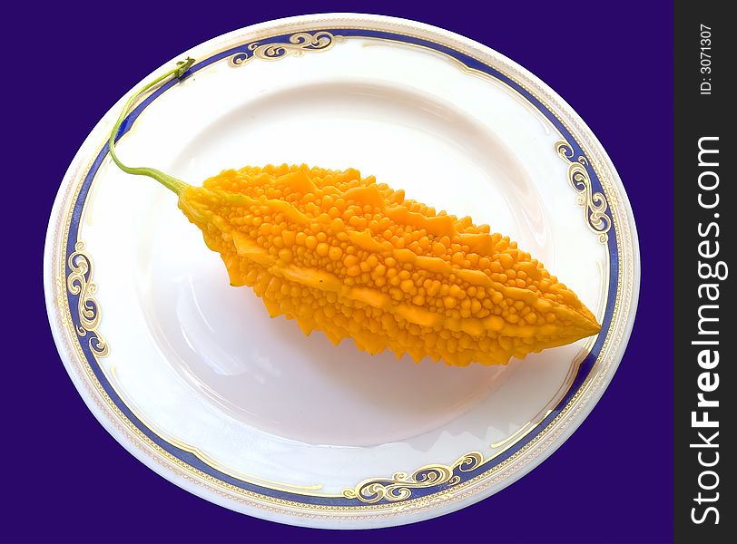 Fruit on a plate. On a dark blue background.