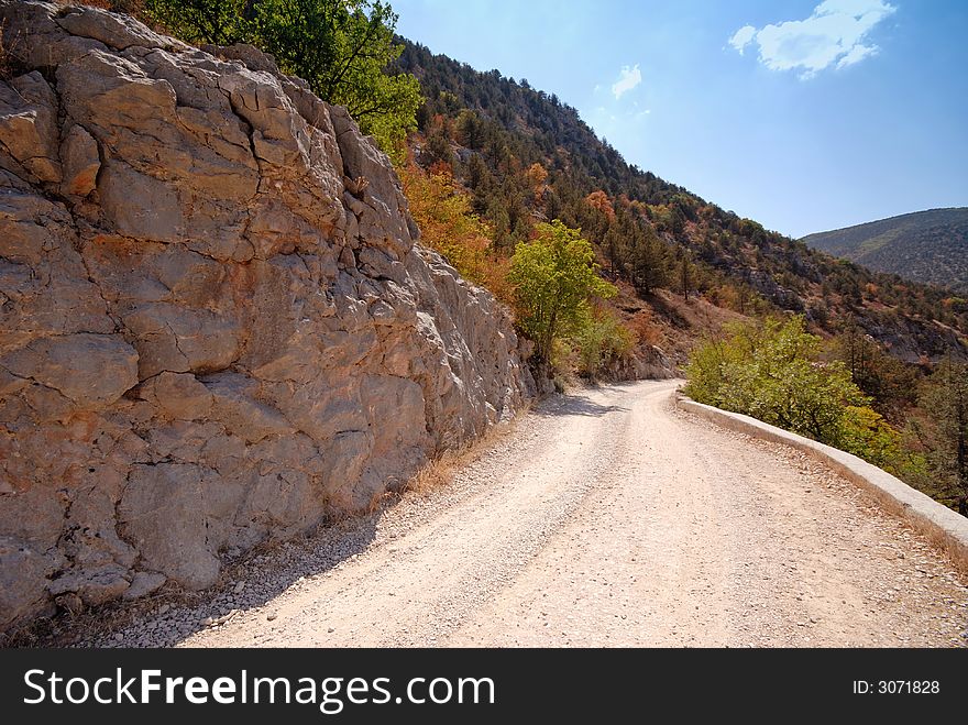 Road in mountains, autumn, midday, Crimea