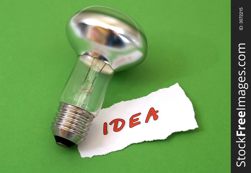 Concept 'idea': reflection bulb on green. Concept 'idea': reflection bulb on green
