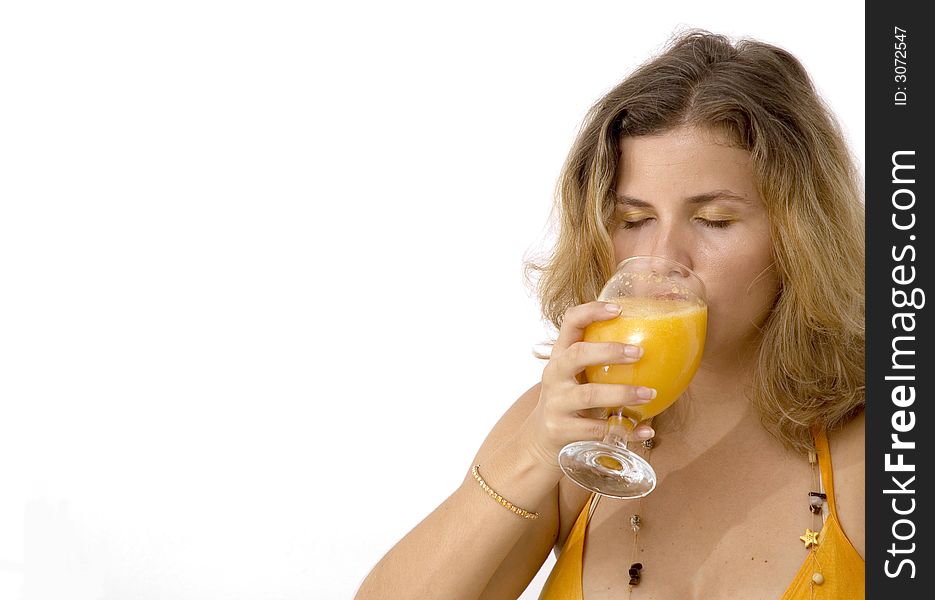 Blond woman drinking orange juice - isolated. Blond woman drinking orange juice - isolated