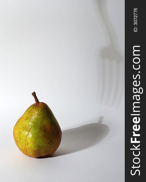The Pear and shadow from fork