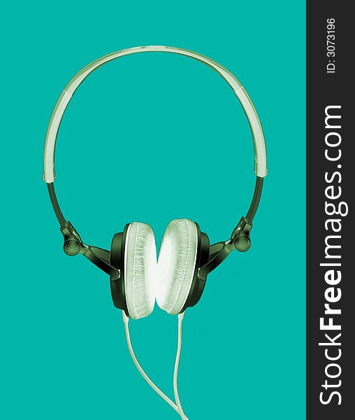 Modern headphones inverted isolated on green