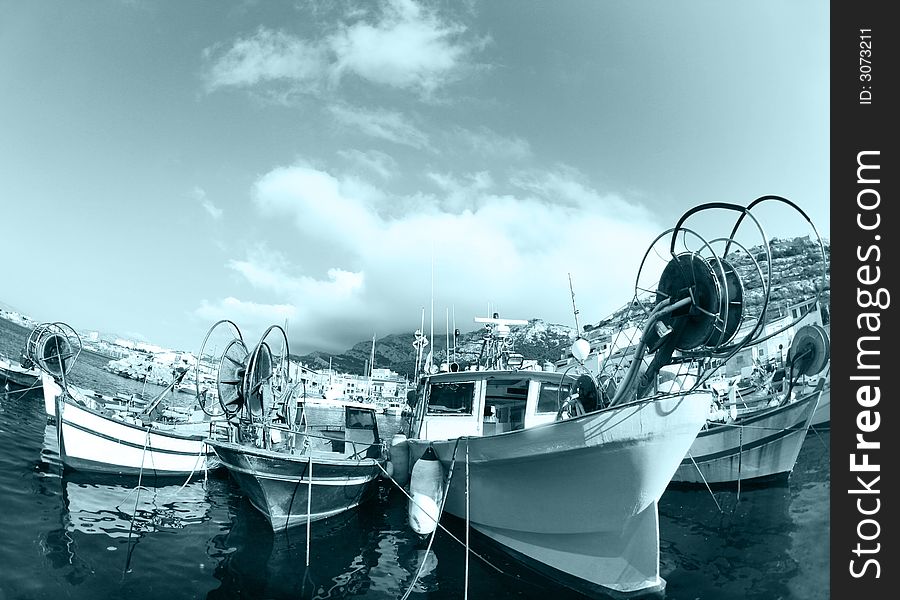 Pretty fishing boats shot with fisheye lens in marseille, france. Pretty fishing boats shot with fisheye lens in marseille, france