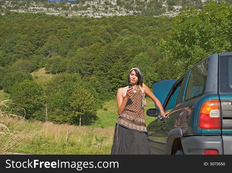 Woman breaking down of car and discussing with her telephone. Woman breaking down of car and discussing with her telephone