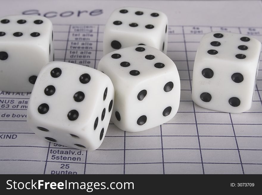 Five dice on a scoreboard
