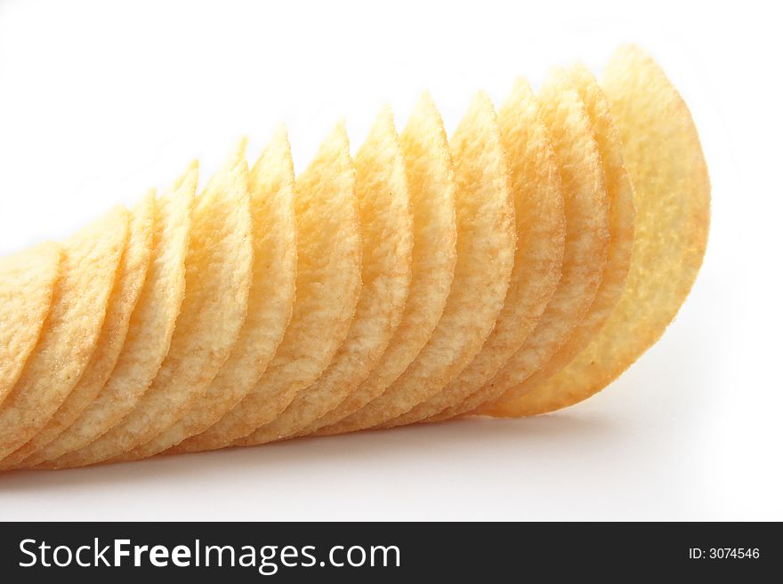 On a photo potato chips. The photo is isolated.