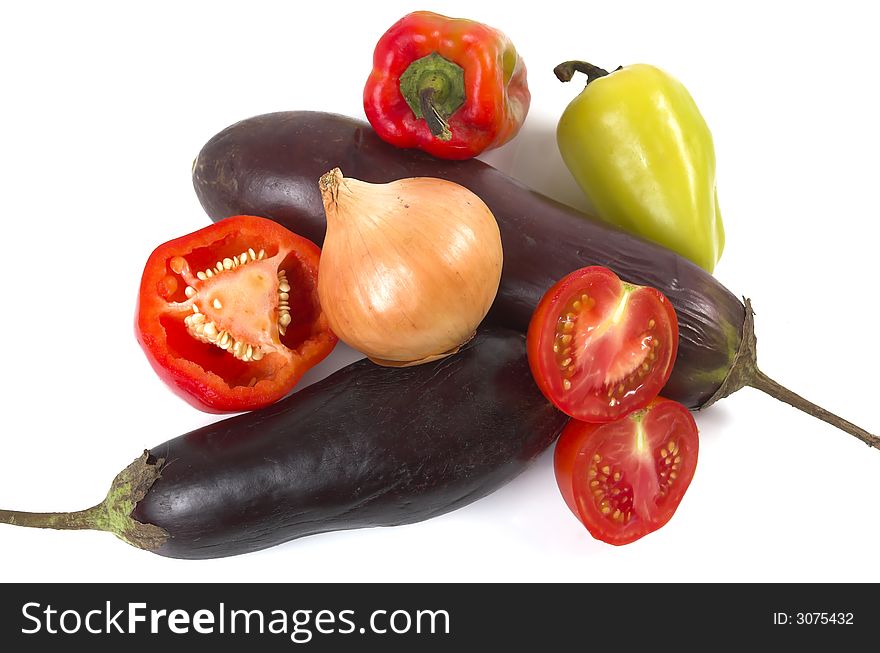 Eggplant, pepper, onions and tomatoes on a white background