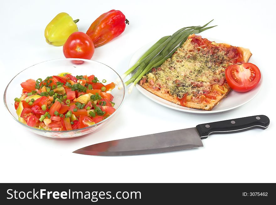 Salad, vegetables and pizza on a white background