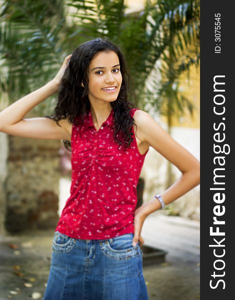 Beautiful smiling young woman in red. Beautiful smiling young woman in red