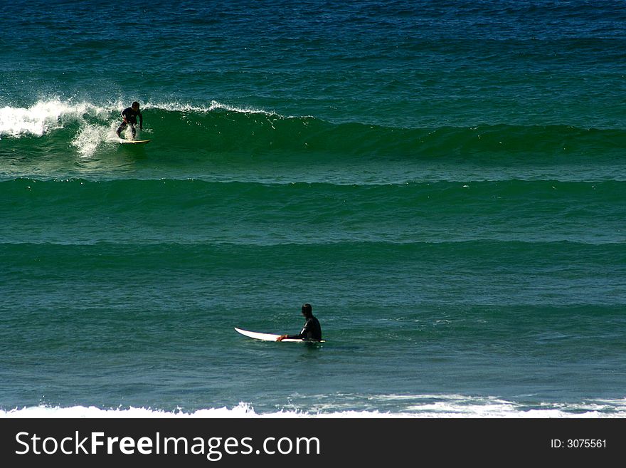 A surfer riding the wave. A surfer riding the wave