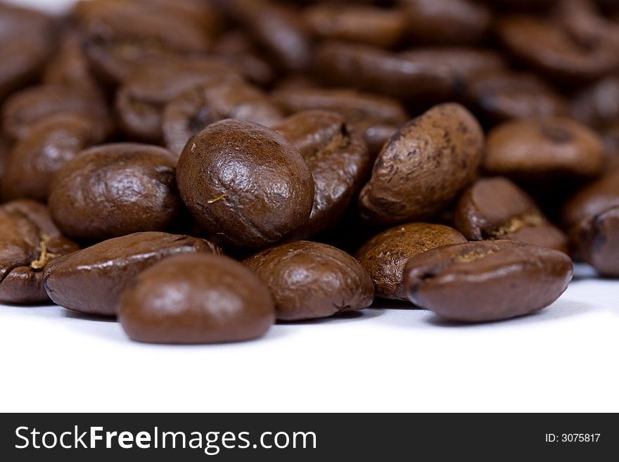 Coffee beans closeup on white background