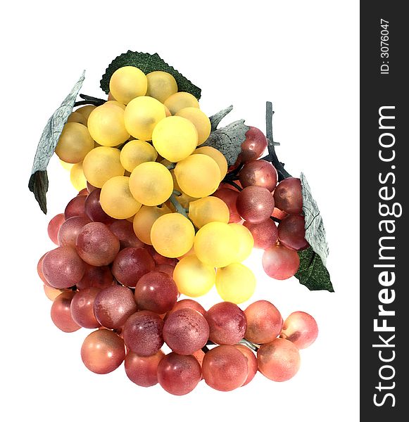 Two branches of grapes, purple and yellow, on a pure white background,. Two branches of grapes, purple and yellow, on a pure white background,