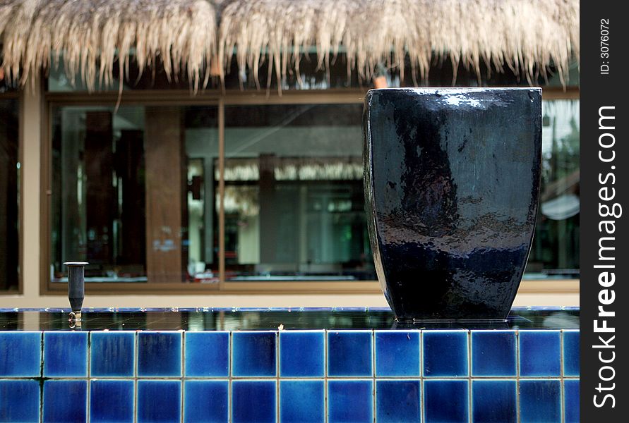 Blue ceramic pot in a water display.