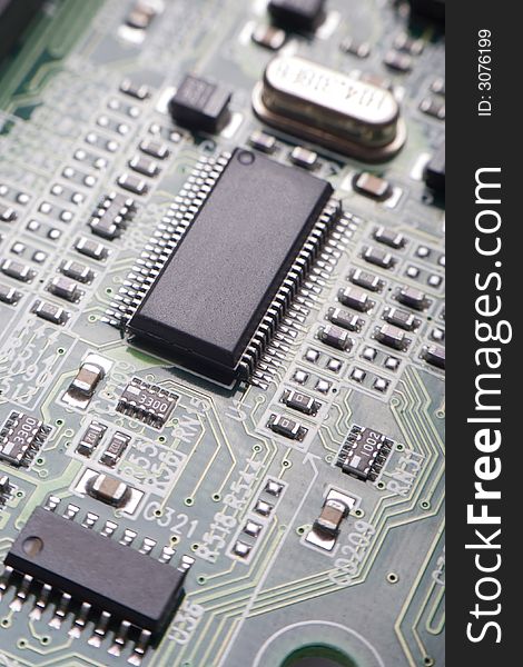 Motherboard's green electronic circuit - macro with shallow depth of field. Motherboard's green electronic circuit - macro with shallow depth of field