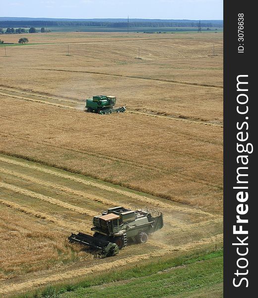 End of summer is busy time for farmers. This combine is reaping rye. End of summer is busy time for farmers. This combine is reaping rye.