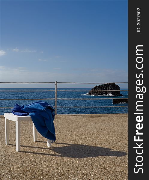 Sun, sea and chair with towel