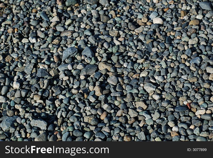 Pebbles at pavement of the side walk. Pebbles at pavement of the side walk.