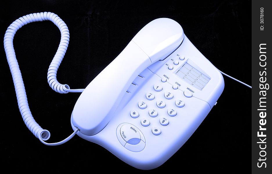 A telephone, blue tint against black