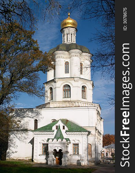 Orthodoxy christianity church with gold cupola under blue sky