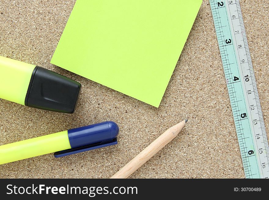 Office tools on cork board