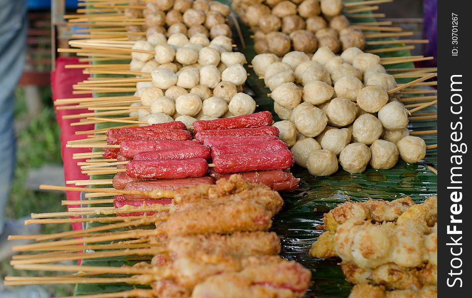 Meatballs and hotdog fried , thai street food