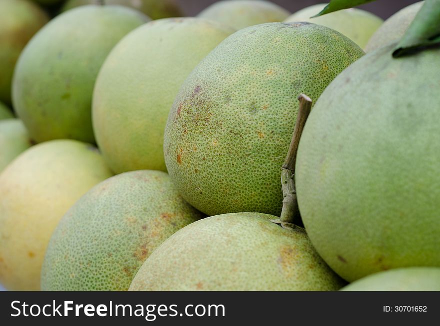 Green pomelos in market ,Thailand