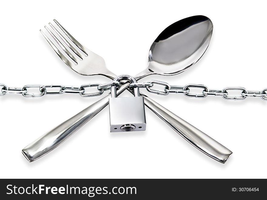 "The spoon and fork with a chain and padlock on a white background"