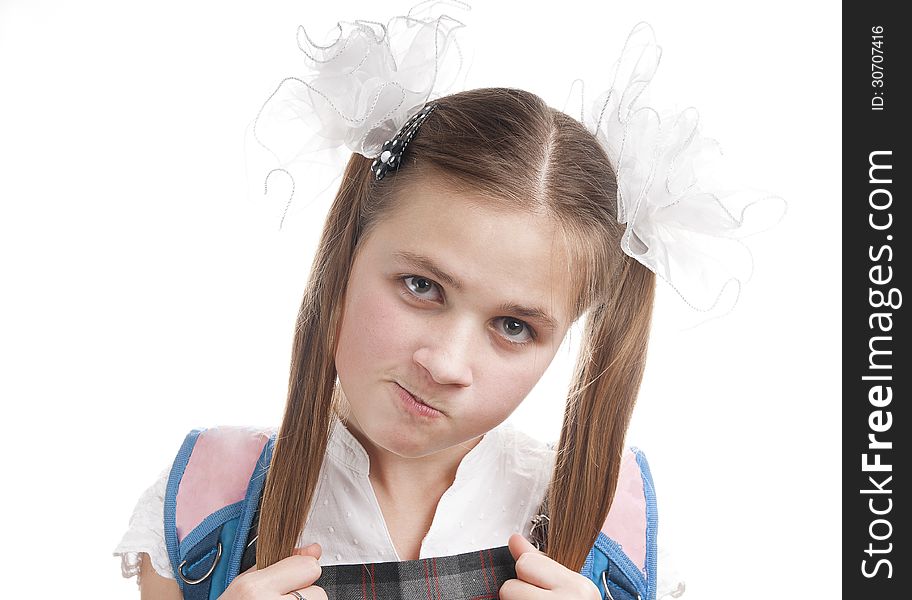 Dissatisfied schoolgirl on white background. Dissatisfied schoolgirl on white background.