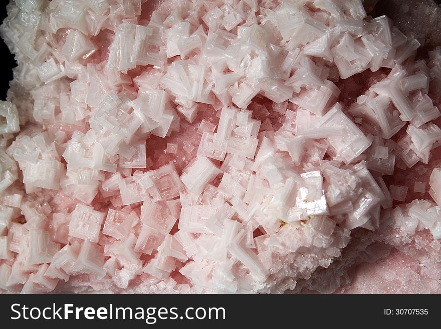 Crystals of pink halite as a background