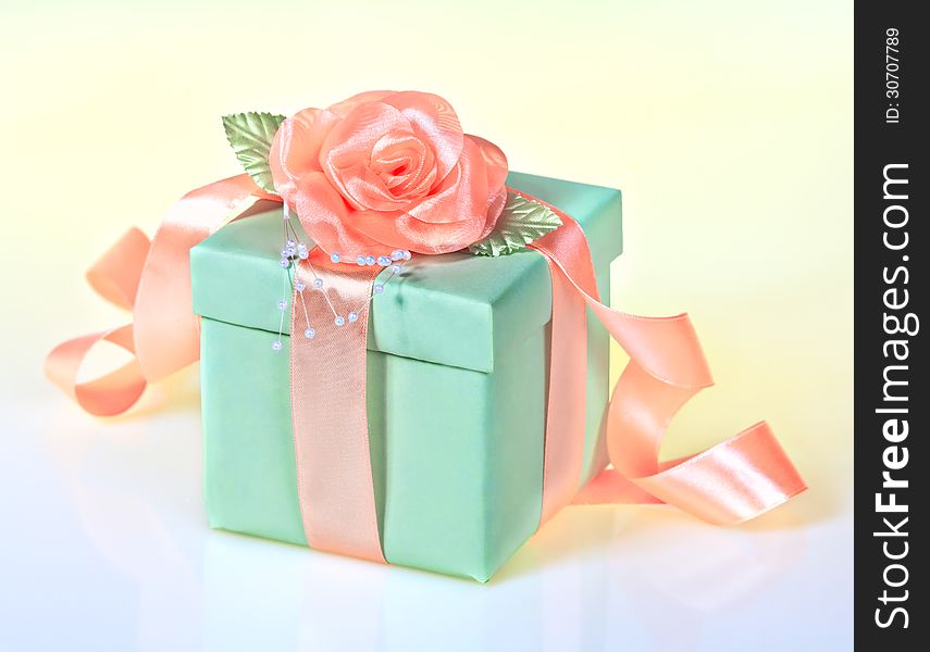 The green gift box with rose ribbon. The green gift box with rose ribbon