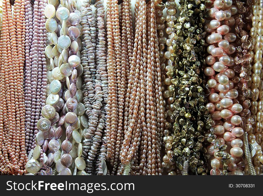 Many colorful pearl necklaces