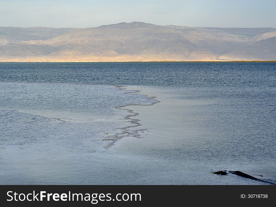 Calm evening at Dead sea coast and Jordan mountains view. Calm evening at Dead sea coast and Jordan mountains view.