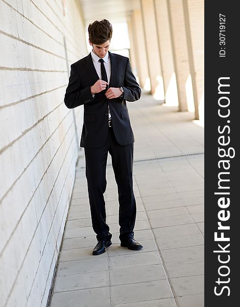 Portrait of an attractive young businessman in urban background