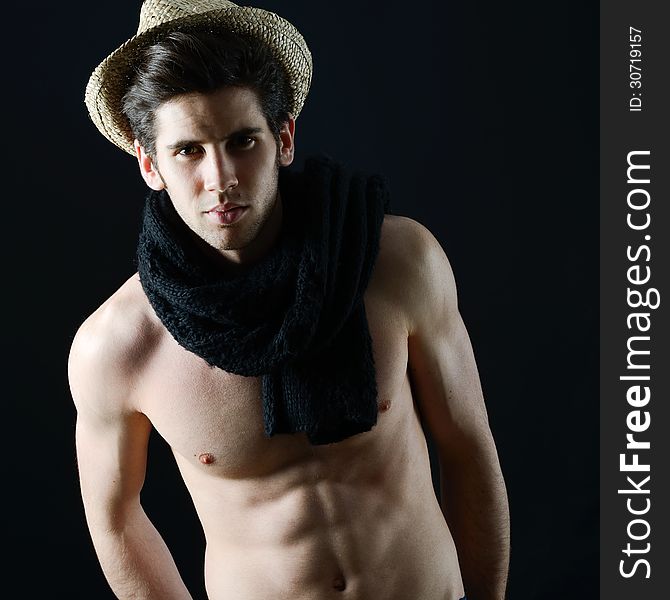 Portrait of handsome man wearing hat and scarf
