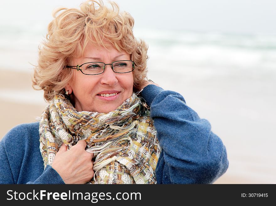 Portrait of happy senior woman at sea