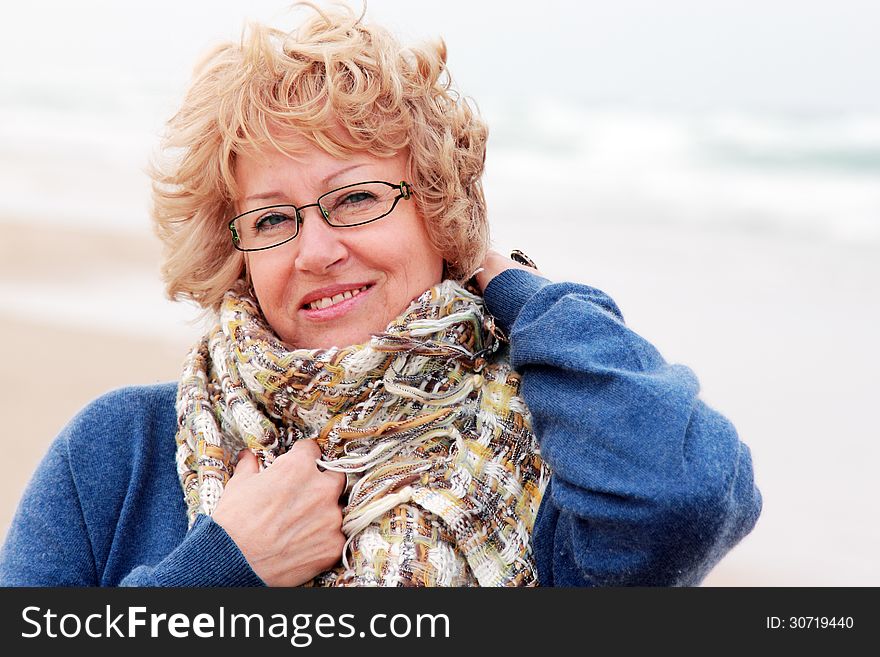 Portrait of happy senior woman at sea