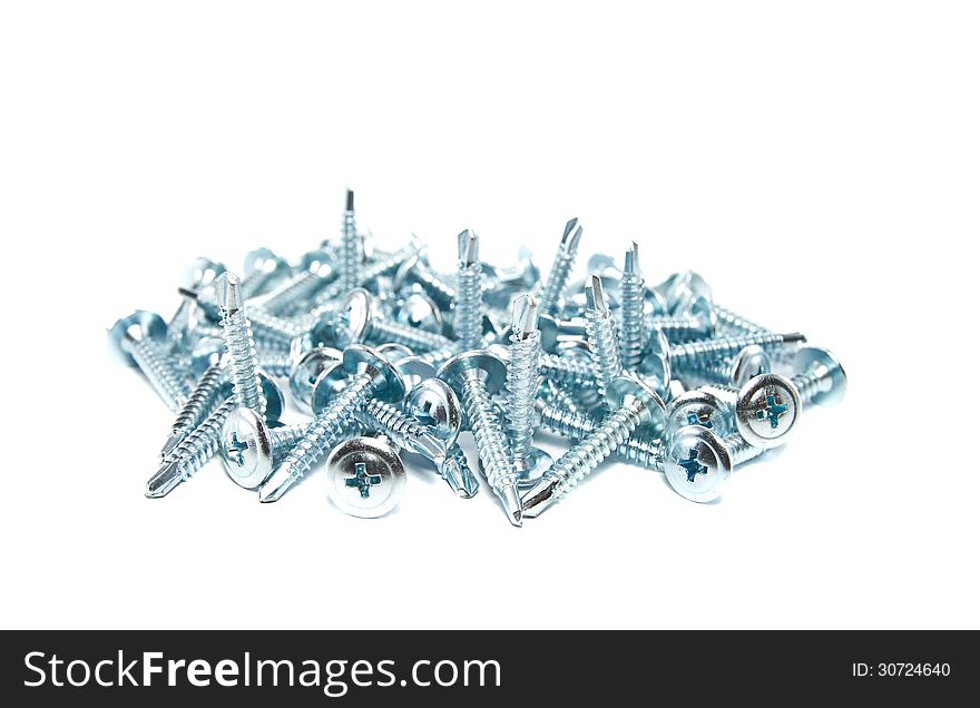 Screws with a drill tip on white background