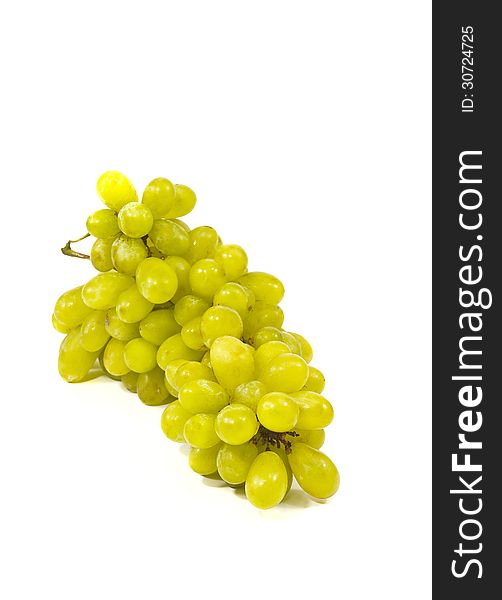Bunch of ripe and juicy green grapes close-up on a white background