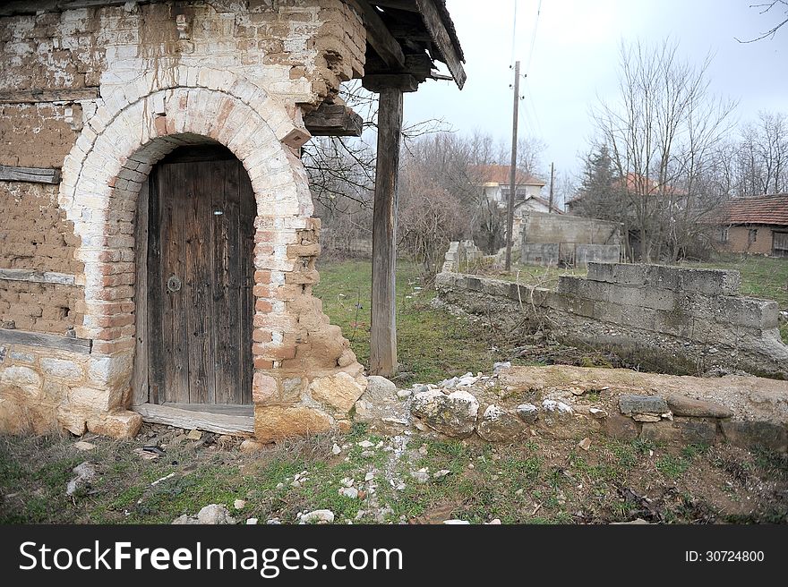 Grunge background texture of demolished building showing scarred walls and door