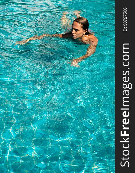 Young woman in the pool. Young woman in the pool